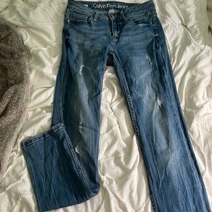 Calvin Klein jeans with butt rip
